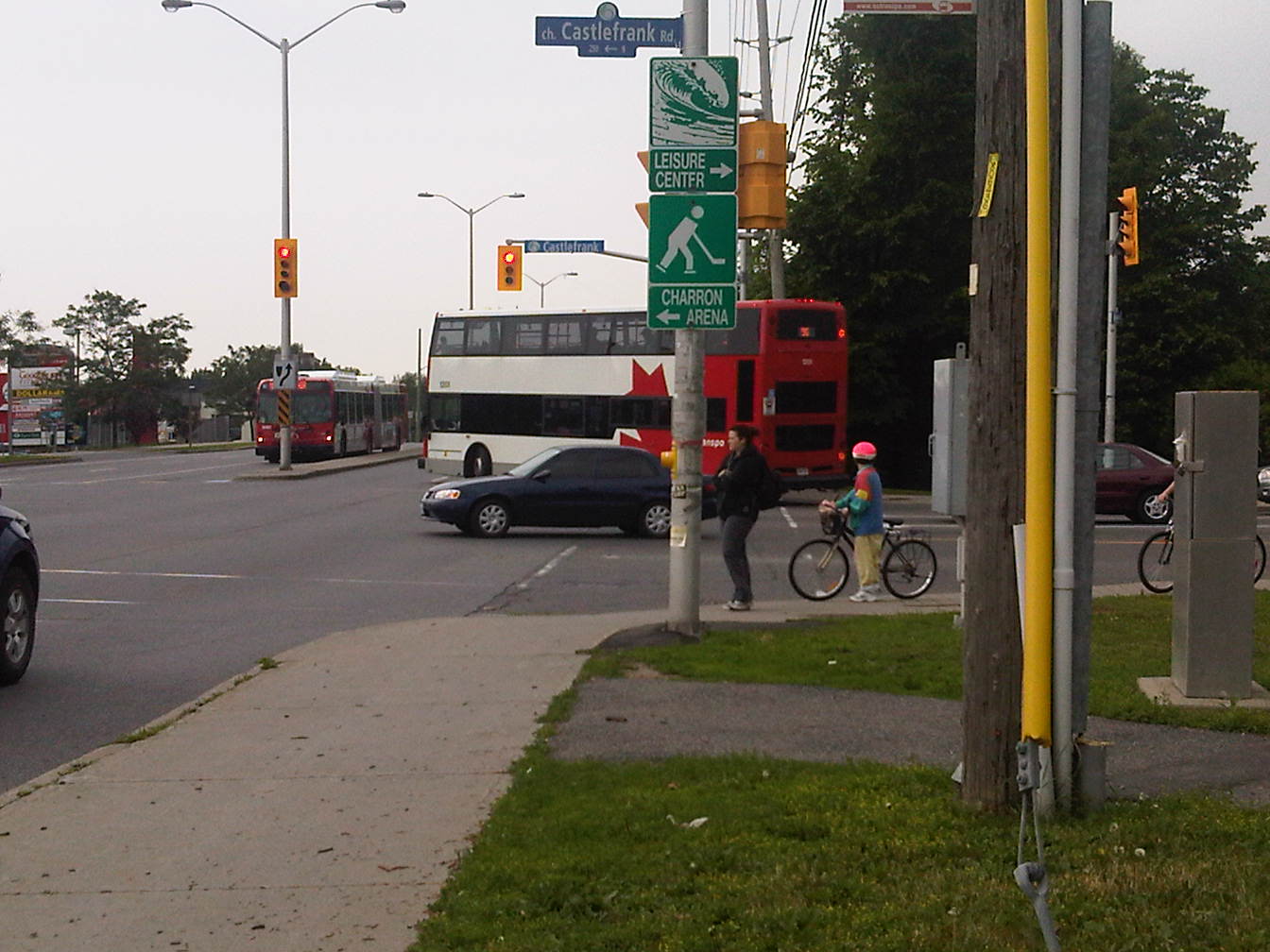 An OC Transpo double-decker and articulated bus at an Ottawa intersection (2011).
